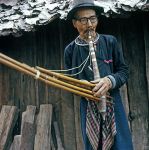 Mao hill tribe man with musical instrument.
